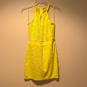 Yellow dress with lace detail and cut out back